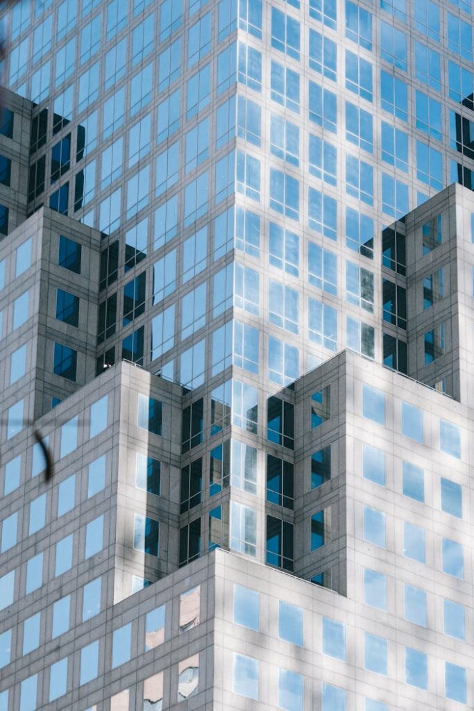 Low angle of modern multistage office complex with unusual geometric design located in downtown